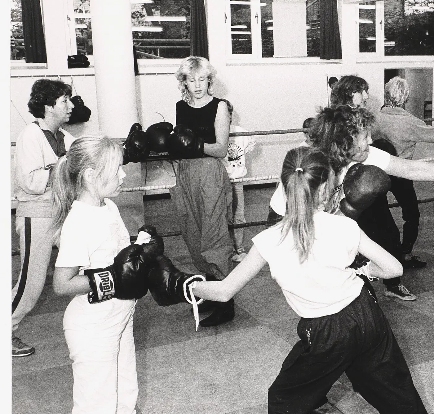 A group of women training together in a boxing gym, September 1985